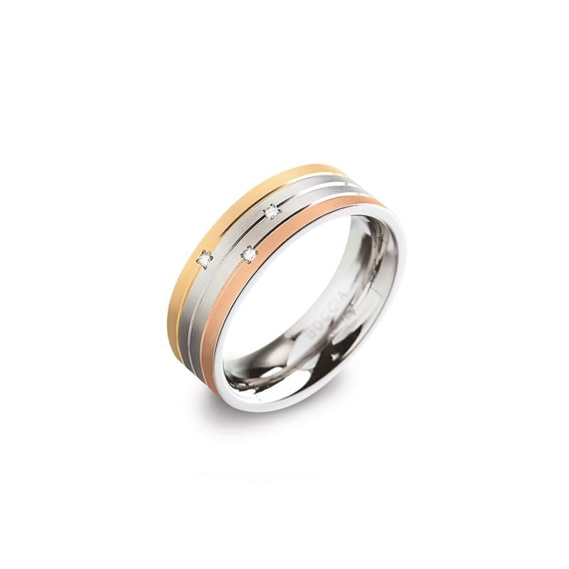 Bague en titane tricolore avec des détails en or rose et argent, ornée de trois diamants.
