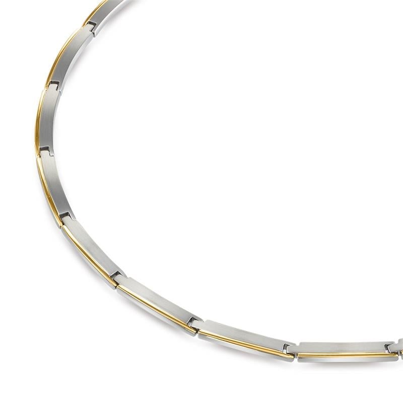 Collier bicolore en titane avec des maillons argentés et dorés.