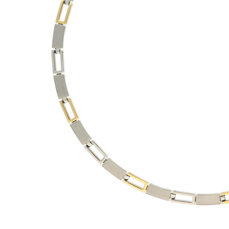 Collier bicolore en titane avec des maillons rectangulaires argentés et dorés.
