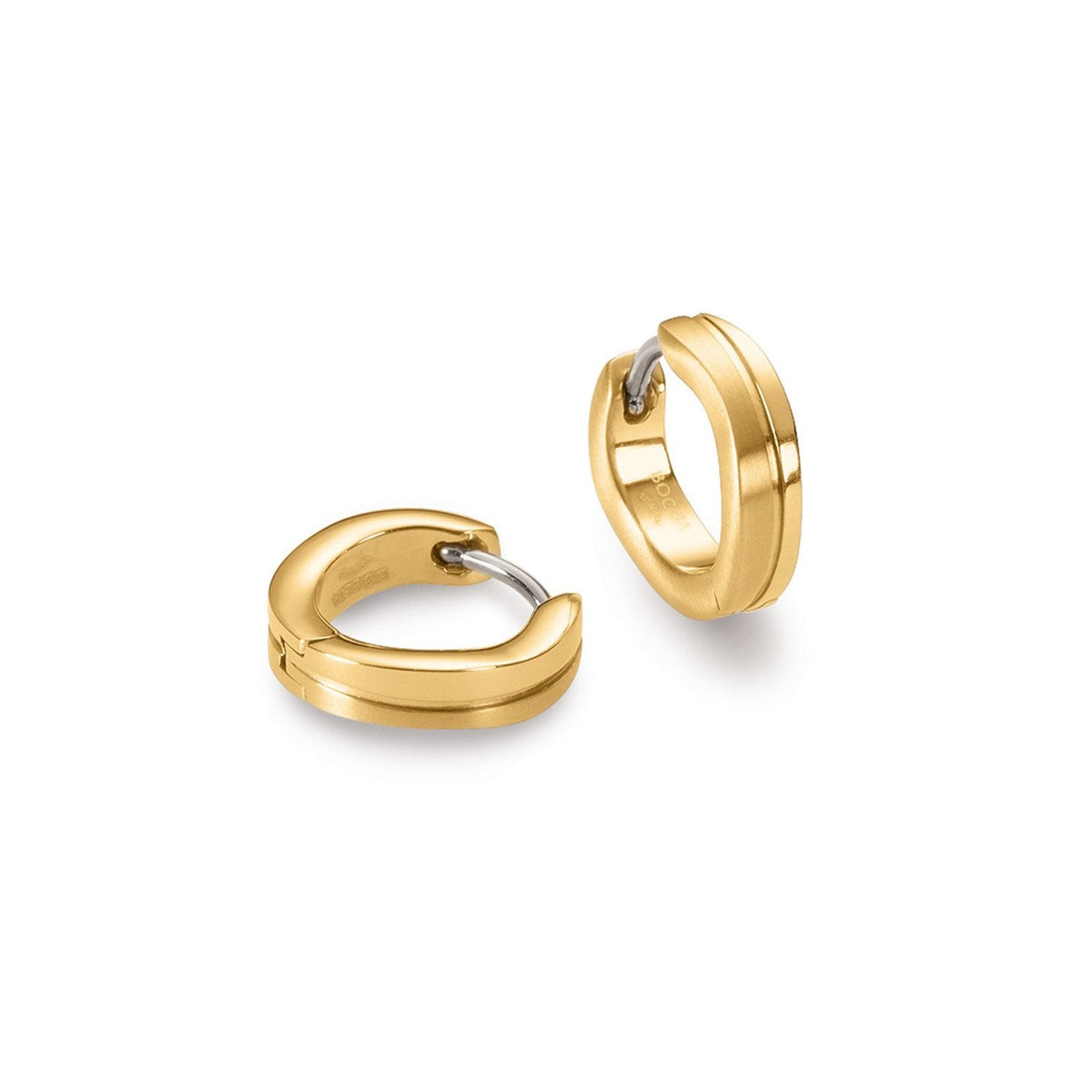 Boucles d'oreilles en titane doré, de forme ronde avec un détail en argent.