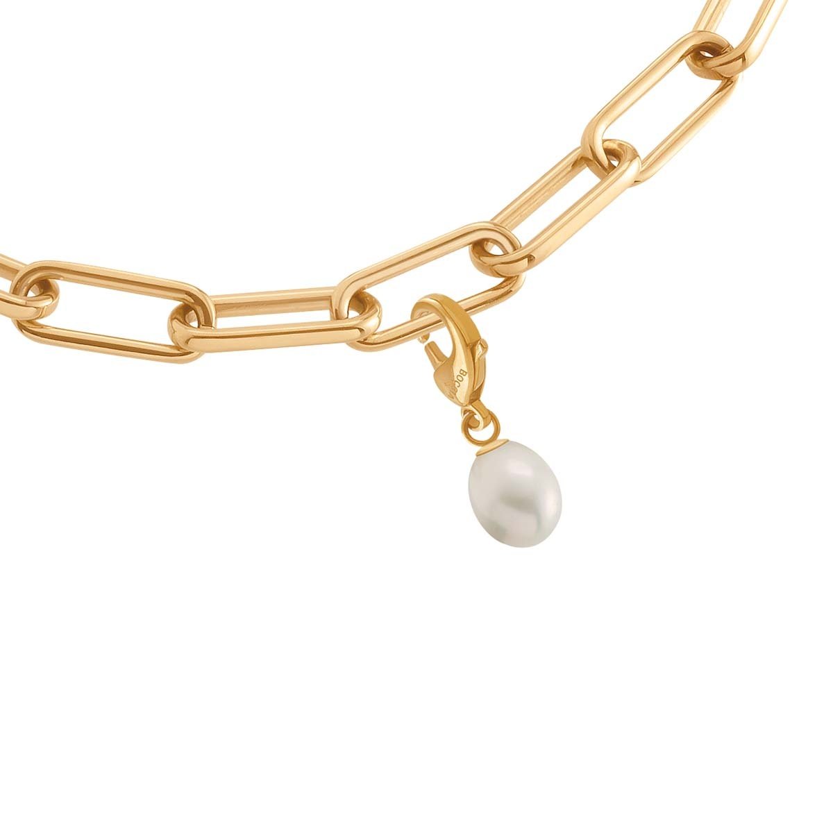 Pendentif en perle sur une chaîne en titane doré, avec un maillon allongé.
