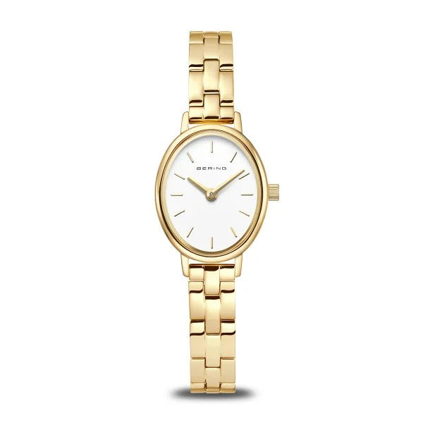 Montre dorée avec un cadran blanc et un bracelet en maillons.