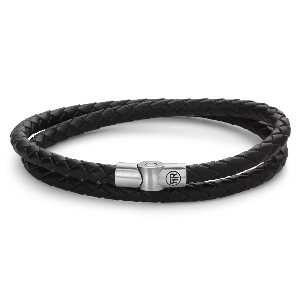 Bracelet en cuir tressé noir avec fermoir en métal argenté.