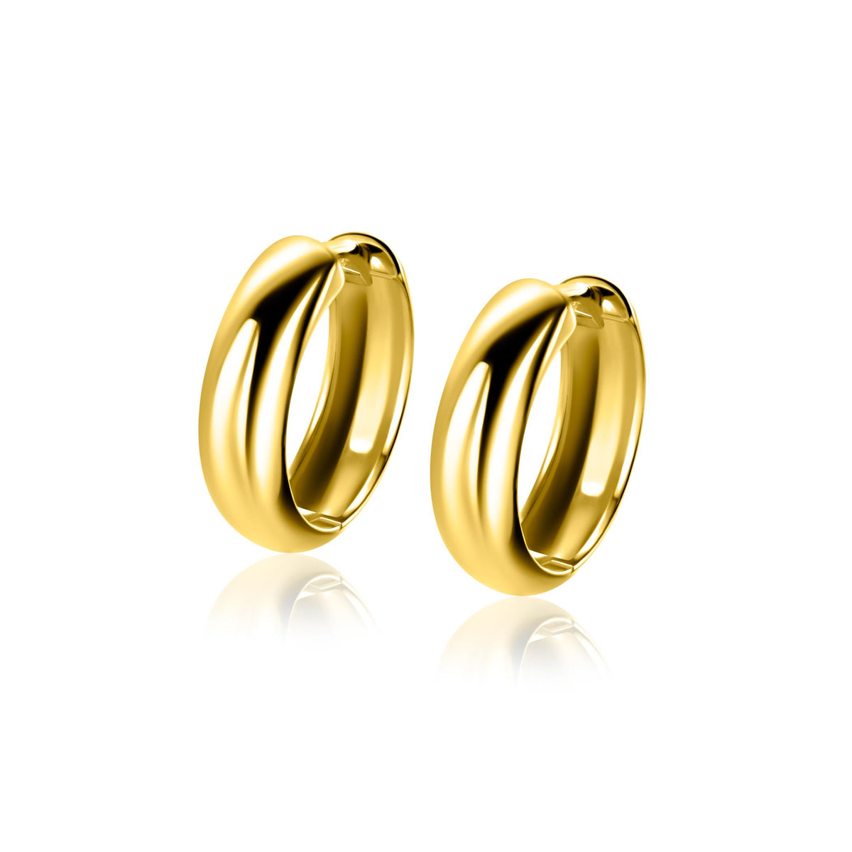 Boucles d'oreilles en argent doré, de forme arrondie et lisse, avec un design moderne.