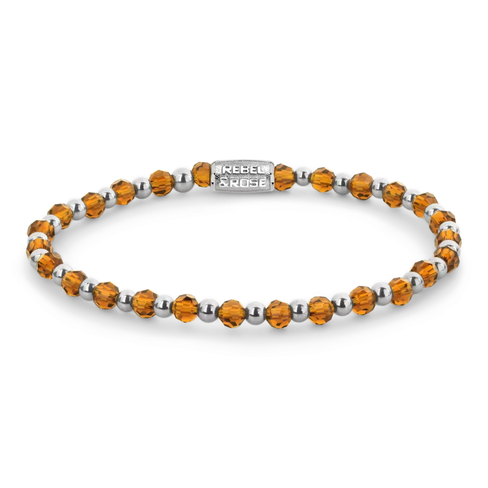 Bracelet en argent avec des cristaux orange et des perles argentées.