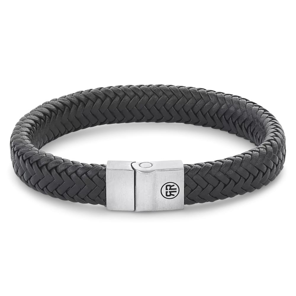 Bracelet en métal noir mat avec motif en chevrons et fermoir en acier.