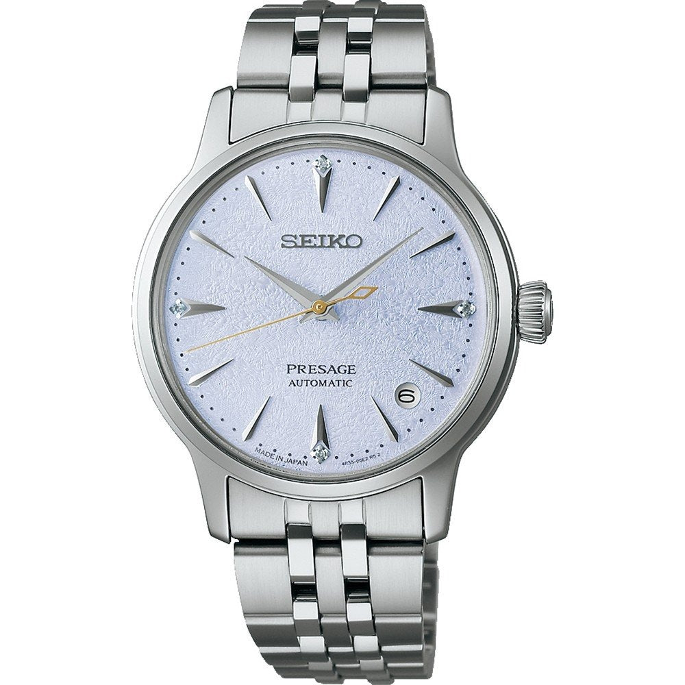 Montre Seiko Presage pour femme avec un cadran argenté et un bracelet en acier inoxydable.