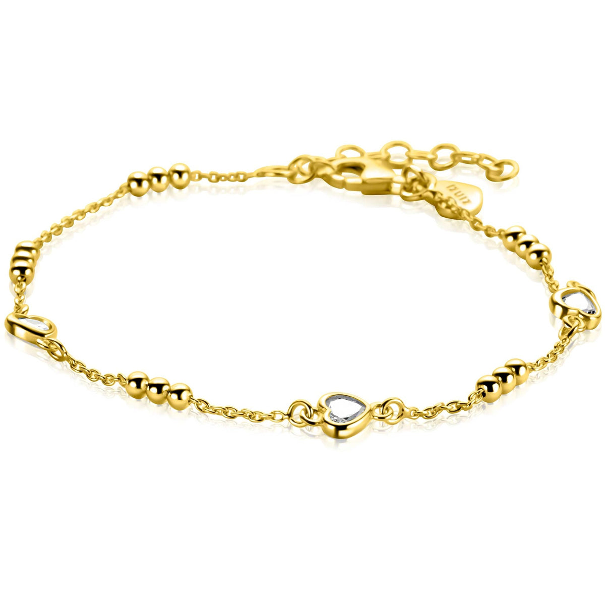 Bracelet doré avec des éléments en forme de cœur et des perles.