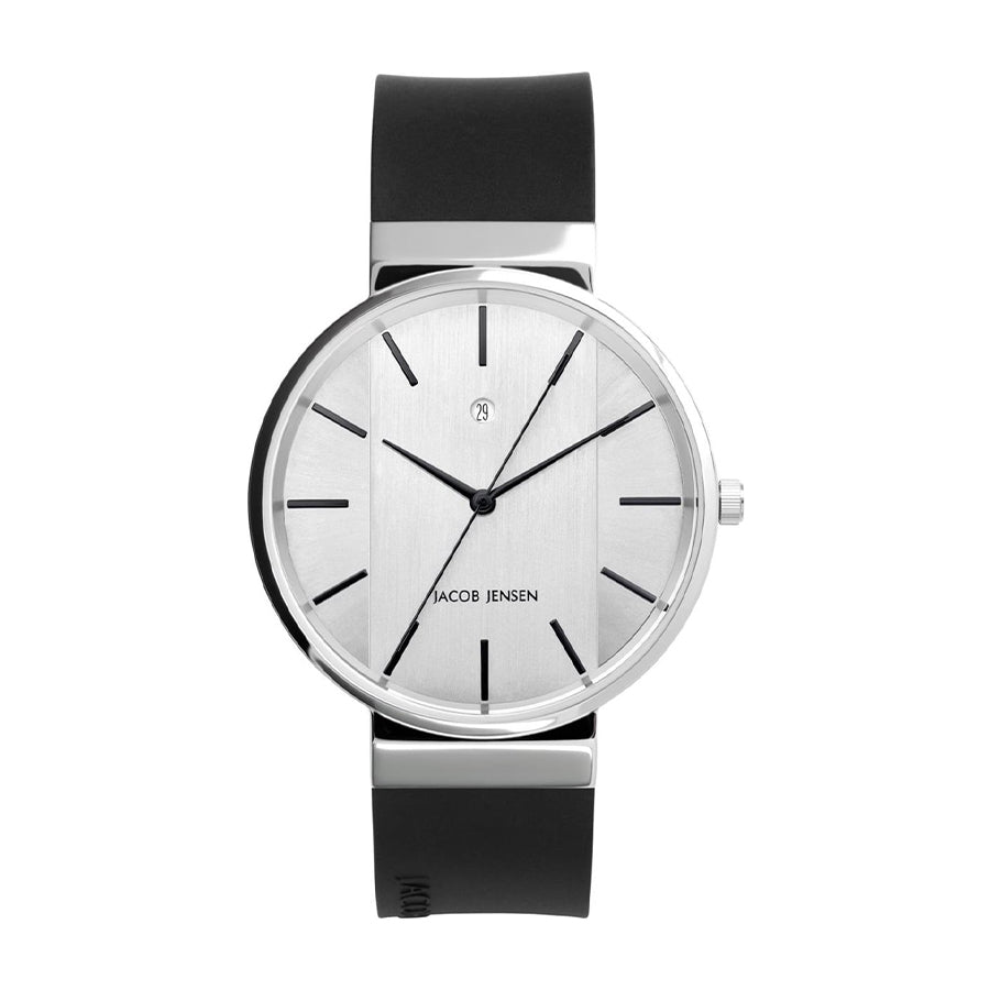 Montre argentée avec cadran minimaliste et bracelet en silicone noir.