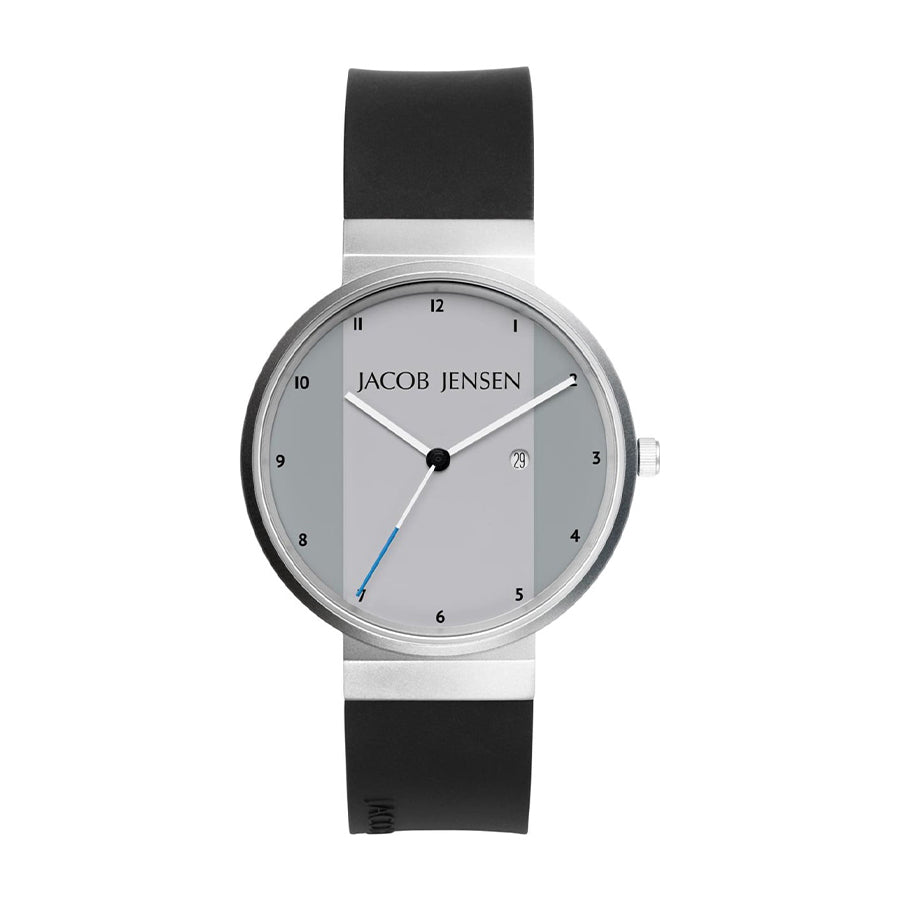 Montre en acier inoxydable avec cadran gris et bracelet en silicone noir.