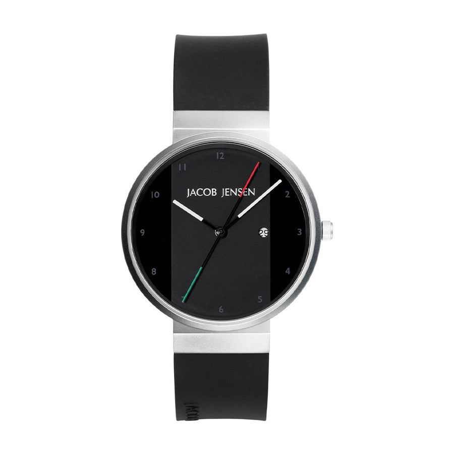 Montre avec boîtier en acier inoxydable, cadran noir, bracelet en silicone noir et aiguilles colorées.
