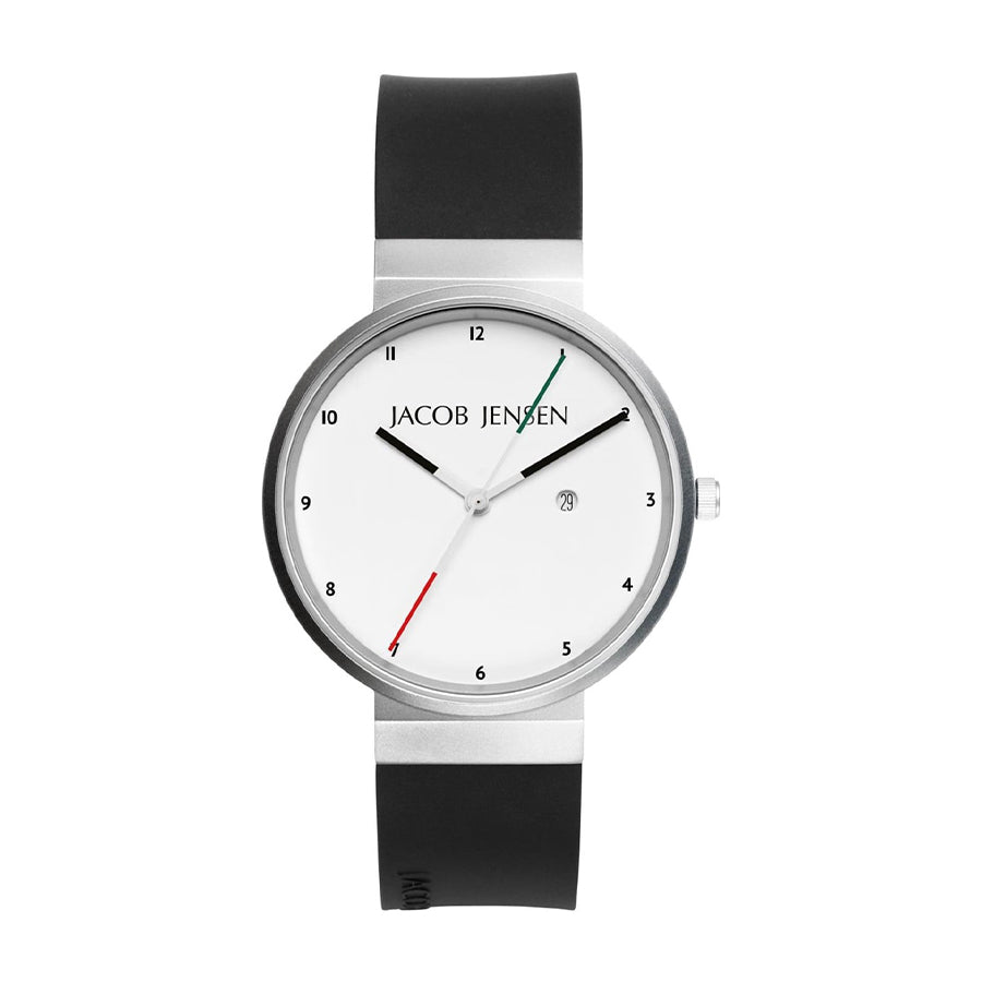 Montre avec boîtier en acier inoxydable, cadran blanc, bracelet en silicone noir et aiguilles colorées.