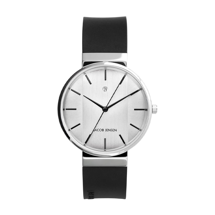Montre argentée avec cadran minimaliste et bracelet en silicone noir.