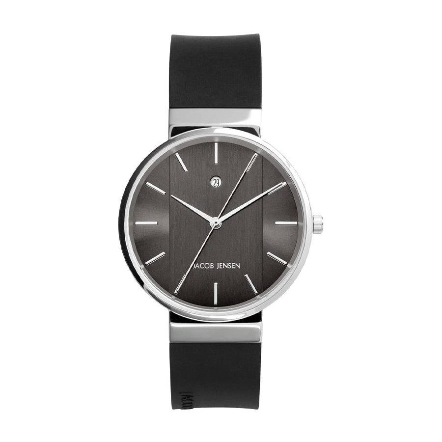 Montre avec boîtier en acier inoxydable, cadran gris et bracelet en silicone noir.