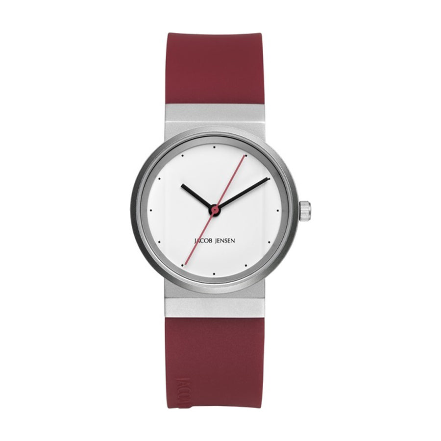 Montre avec boîtier en acier inoxydable, cadran blanc, bracelet en silicone rouge et aiguille rouge.