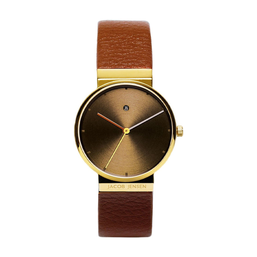 Montre avec un cadran doré et dégradé brun, bracelet en cuir marron.