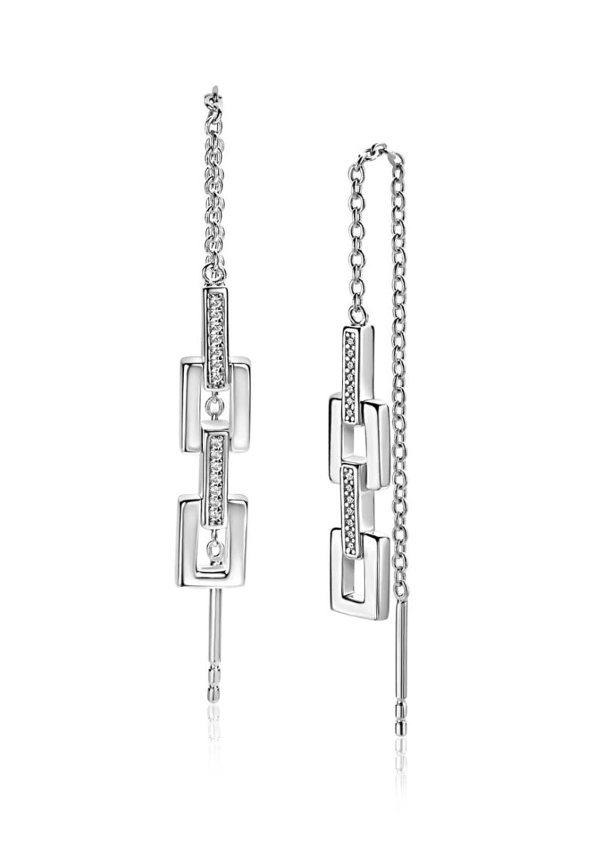 Boucles d'oreilles en argent avec un design géométrique et des détails en strass.