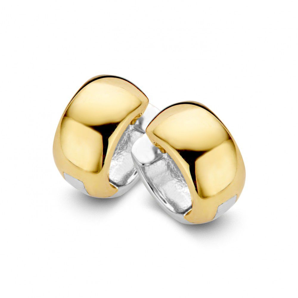 Boucles d'oreilles créoles bicolores en or blanc et jaune, au design réversible et poli.