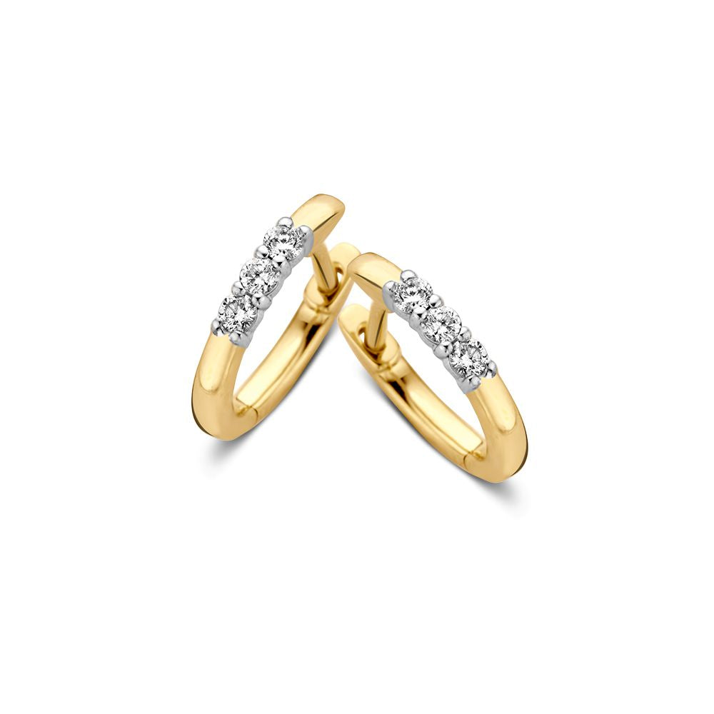 Boucles d'oreilles bicolores en or jaune et blanc avec trois diamants, 14 carats.