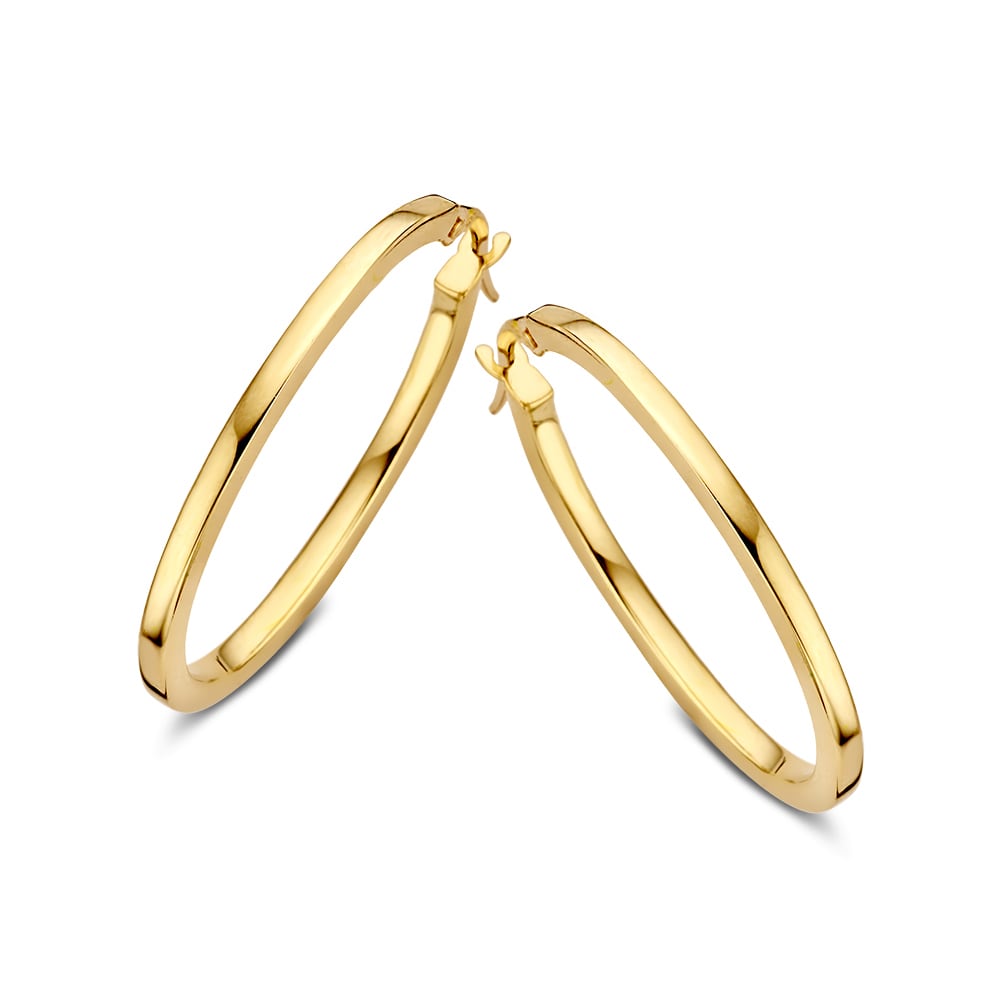 Boucles d'oreilles en or jaune 14 carats, design minimaliste élégant, forme ovale, finition brillante.