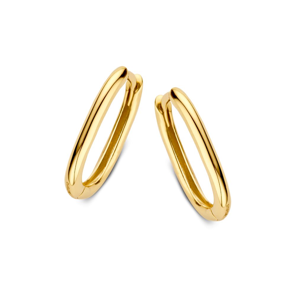 Boucles d'oreilles en or jaune, au design subtil et raffiné, de forme ovale.