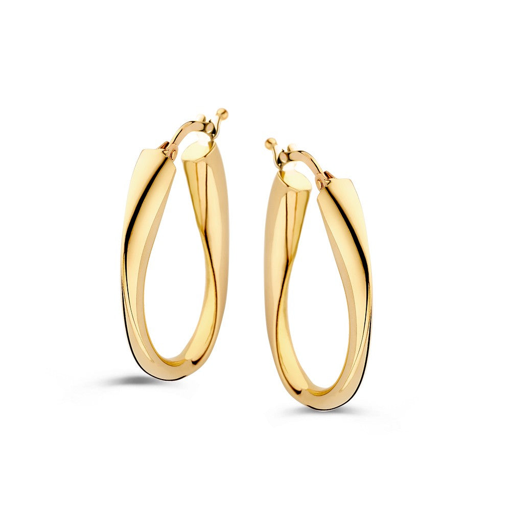 Boucles d'oreilles en or jaune 14 carats avec une forme torsadée et un design ludique.