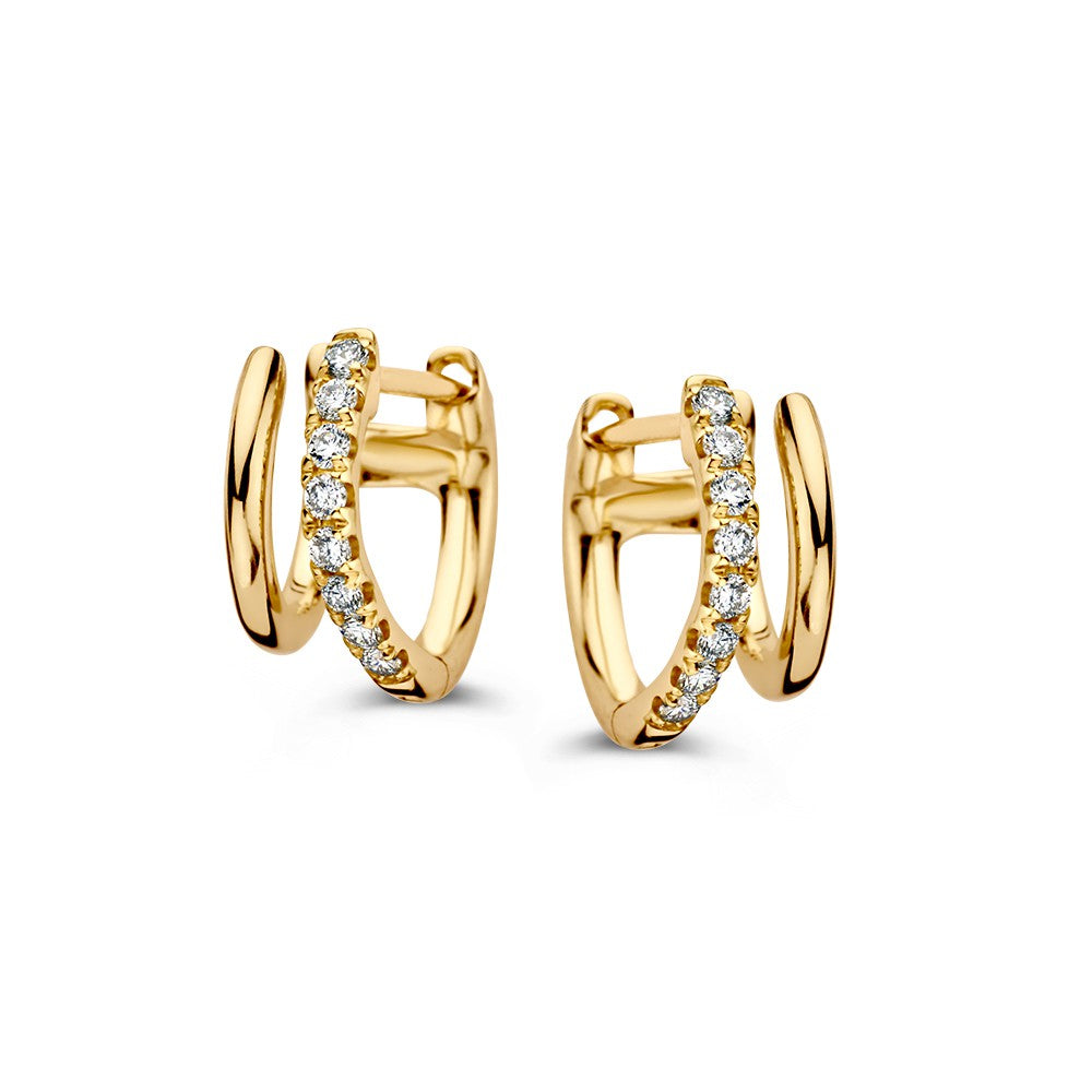 Boucles d'oreilles en or jaune avec des diamants, design ludique et moderne.
