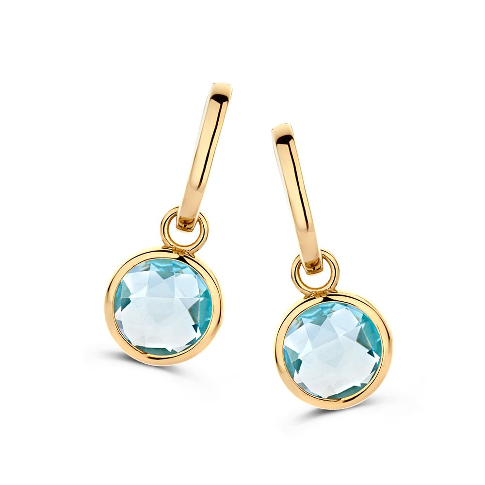 Boucles d'oreilles en or jaune avec pendentifs en topaze bleue, finition brillante.