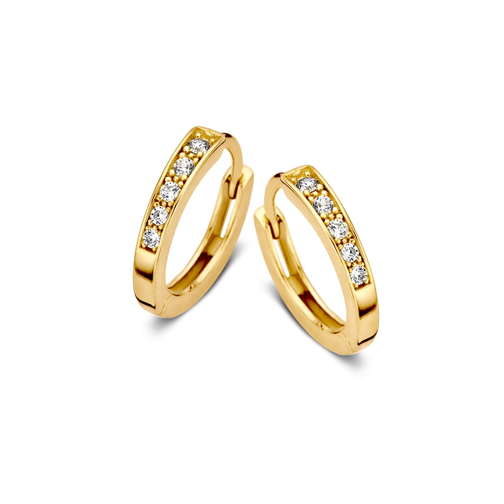 Boucles d'oreilles en or jaune avec des zirconias, forme ronde et finition brillante.