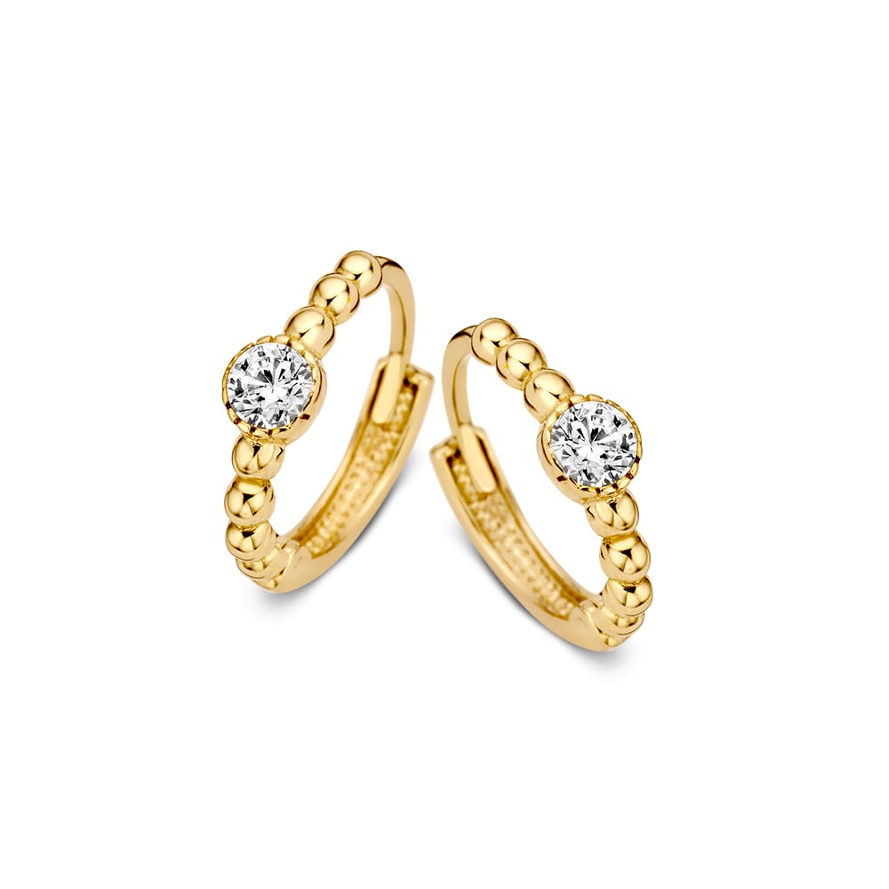 Boucles d'oreilles en or jaune avec des billes dorées et des zirconias, offrant une élégance subtile et ludique.