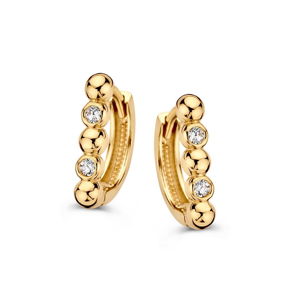 Boucles d'oreilles en or jaune moderne avec des zirkonia, design épuré.