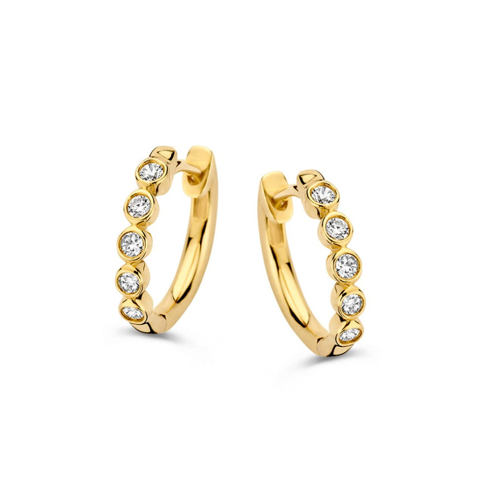 Boucles d'oreilles en or jaune avec des diamants de 0,20 carat.