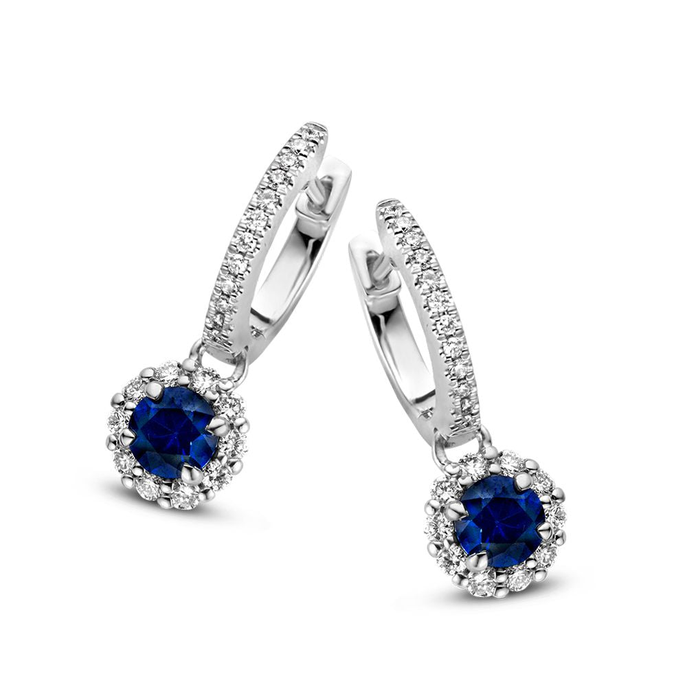 Boucles d'oreilles en or blanc avec pendentifs en saphir, ornées de diamants.