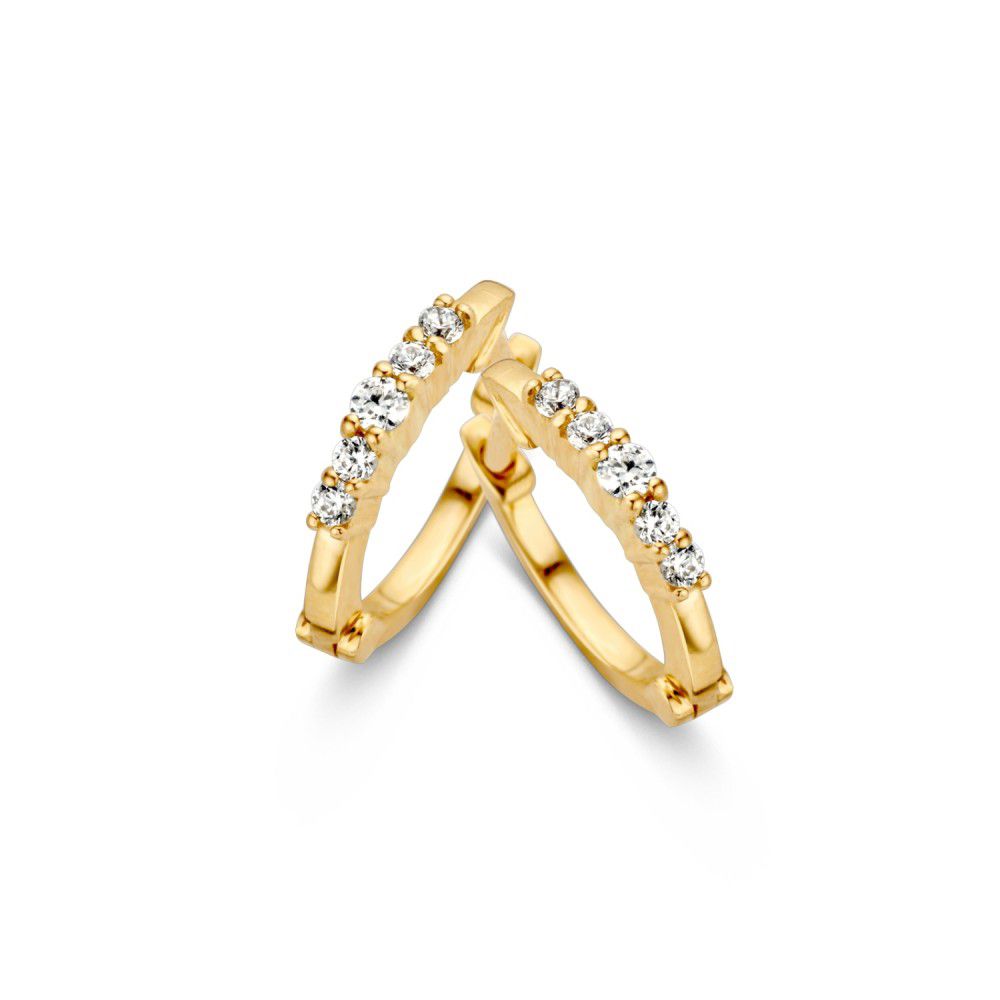Boucles d'oreilles créoles en or jaune, fines, ornées de zircons.