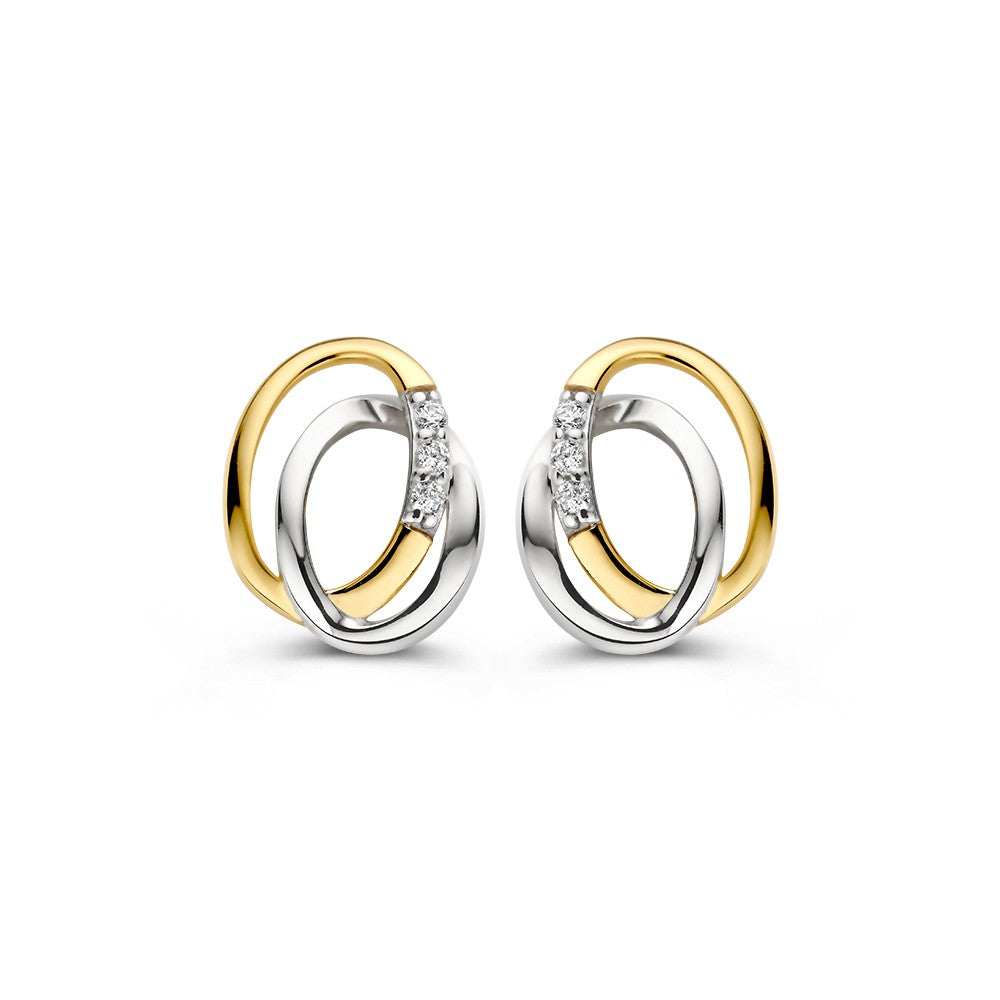 Boucles d'oreilles bicolores en or 14K avec zirconia, formées de deux anneaux entrelacés.