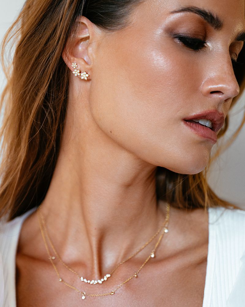 Boucles d'oreilles en or jaune avec trois étoiles et diamants – 1,05 crt.