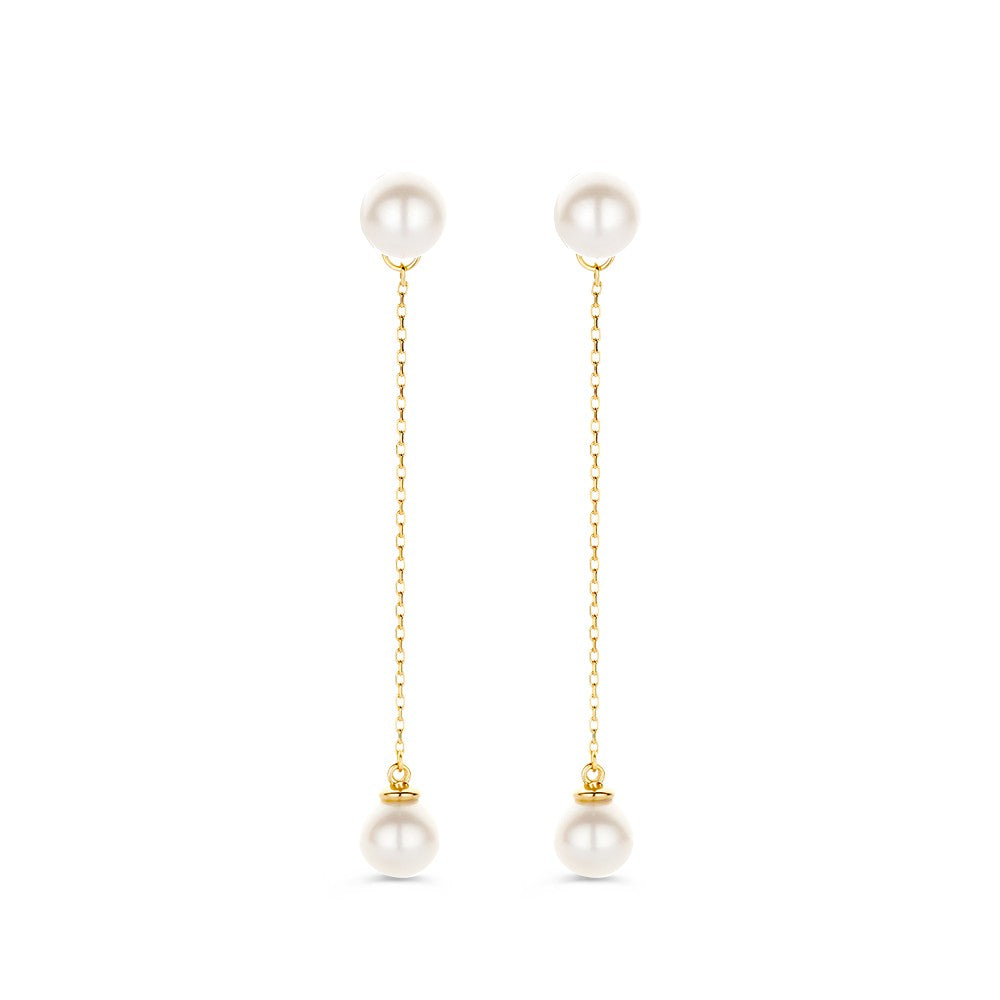 Boucles d'oreilles longues en or jaune 14 carats avec perles blanches.