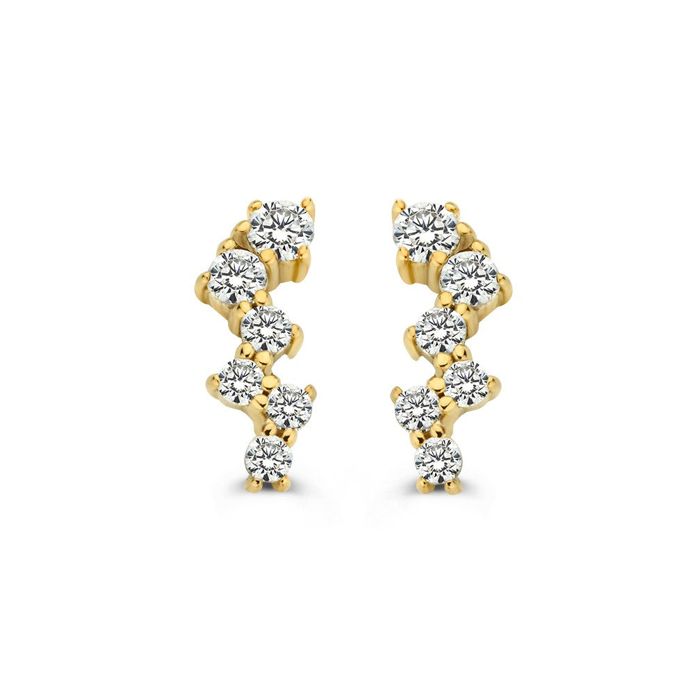 Boucles d'oreilles en or jaune avec zircones dans un sertissage ludique.