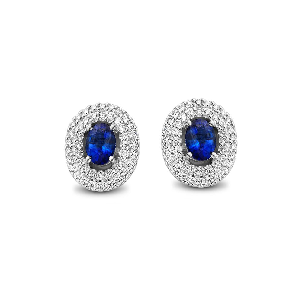 Boucles d'oreilles en or blanc avec saphir bleu et diamants, forme ovale.