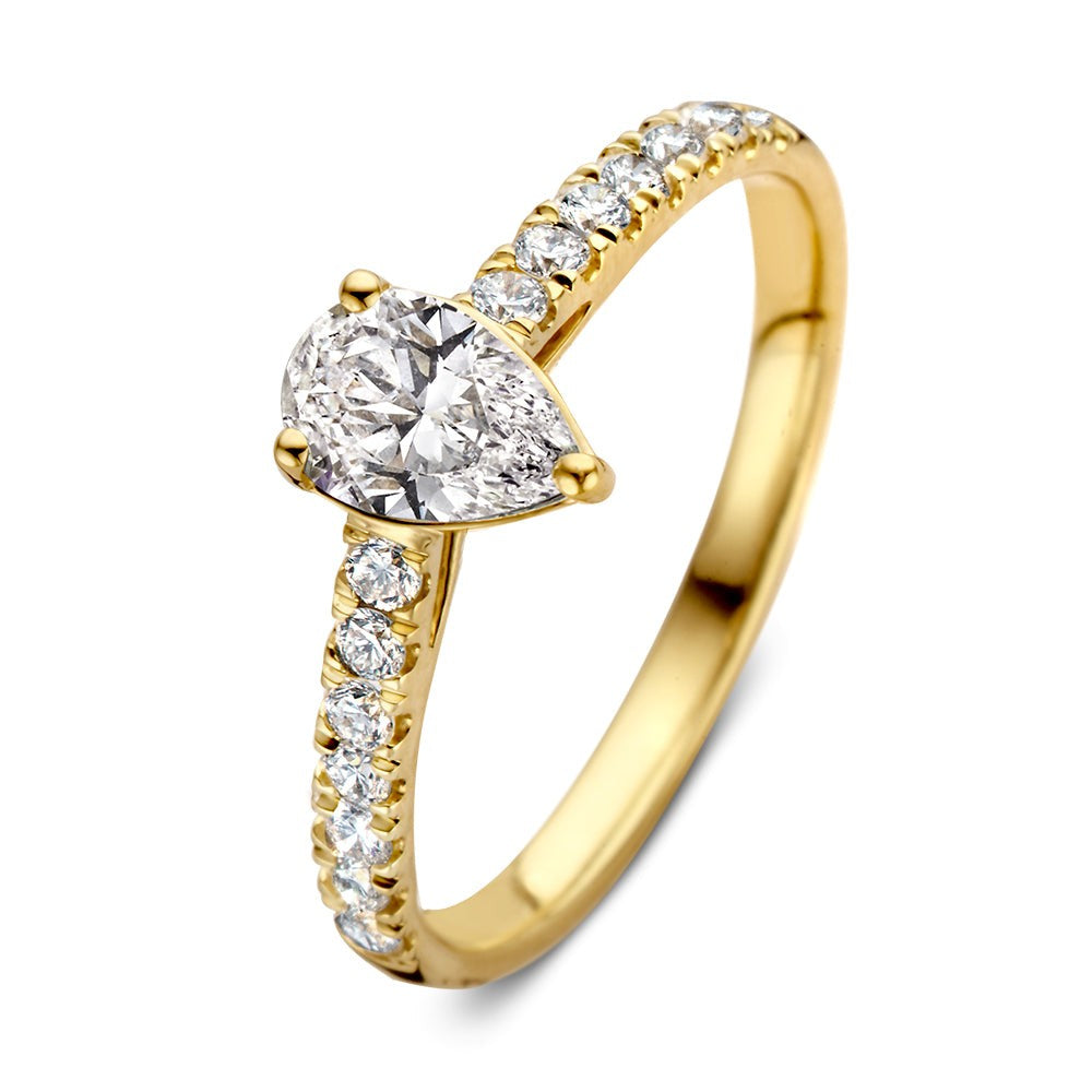 Bague en or jaune avec un diamant en forme de poire et des diamants brillants sur le corps.