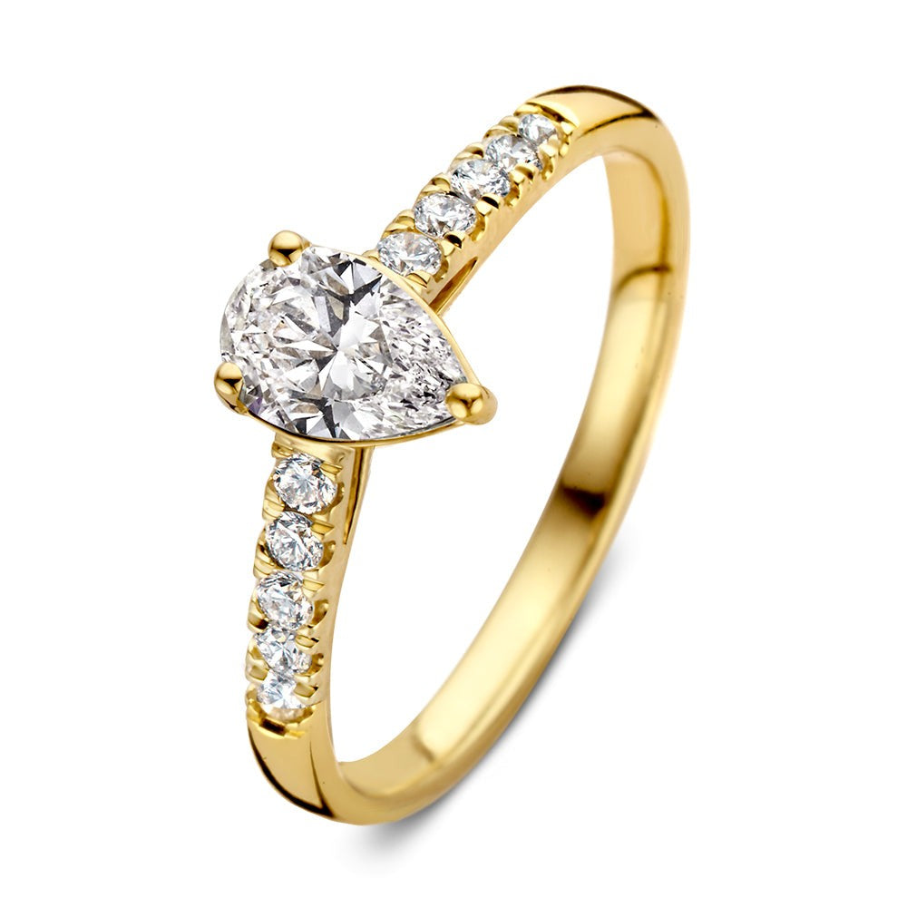 Bague en or jaune avec un diamant en forme de poire et des diamants brillants sur le côté.