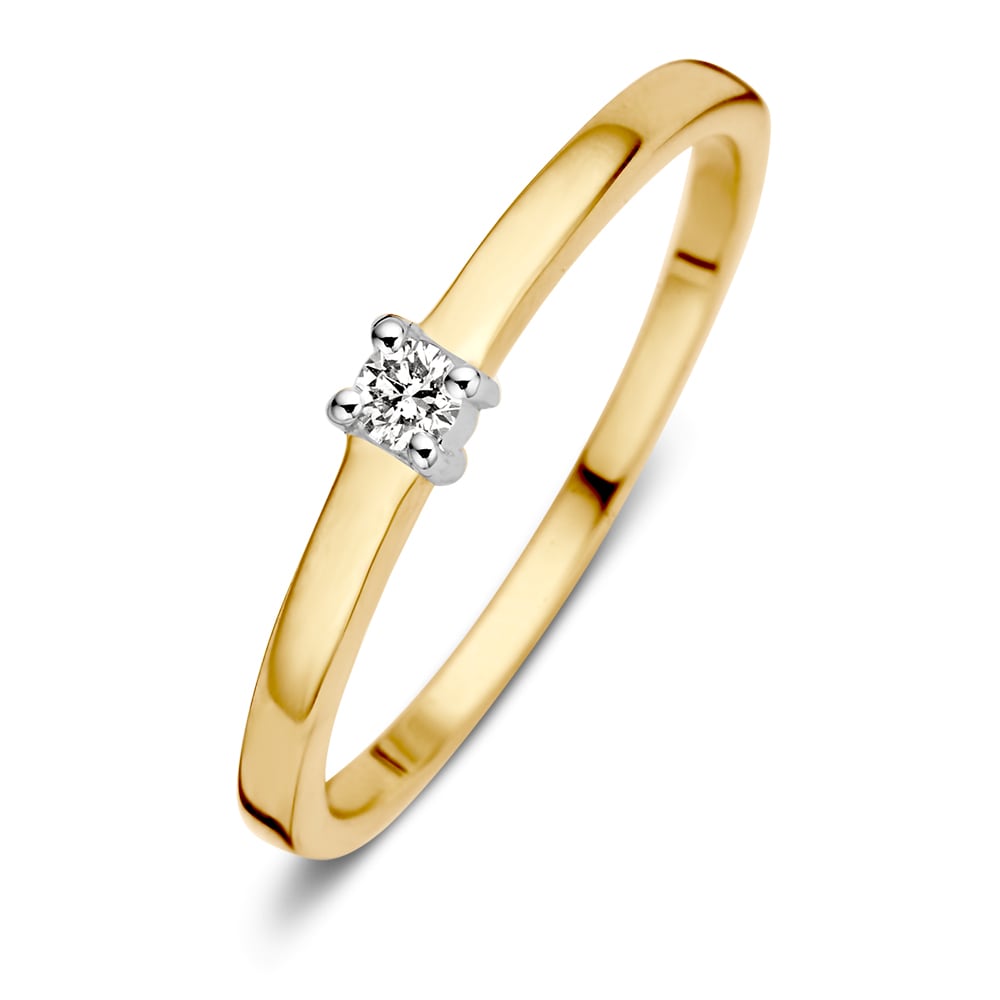 Bague en or bicolore avec un diamant taillé en brillant au centre.
