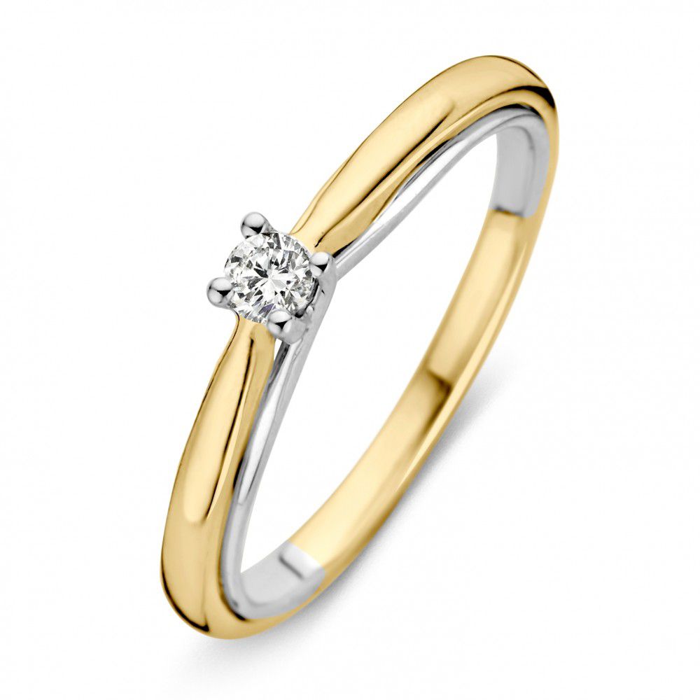 Bague en or bicolore de 14 carats avec un diamant taille brillant.