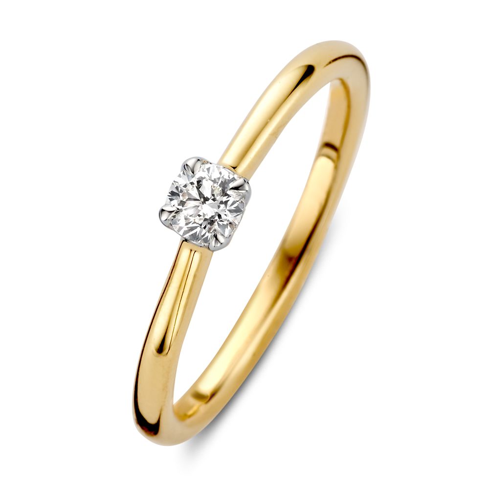 Bague en or bicolore avec un diamant brillant de 0,20 carat.