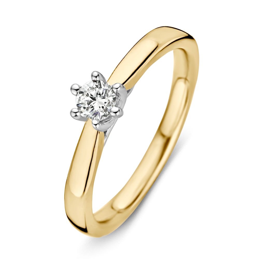Bague bicolore en or jaune et blanc avec un diamant de 0,24 ct.
