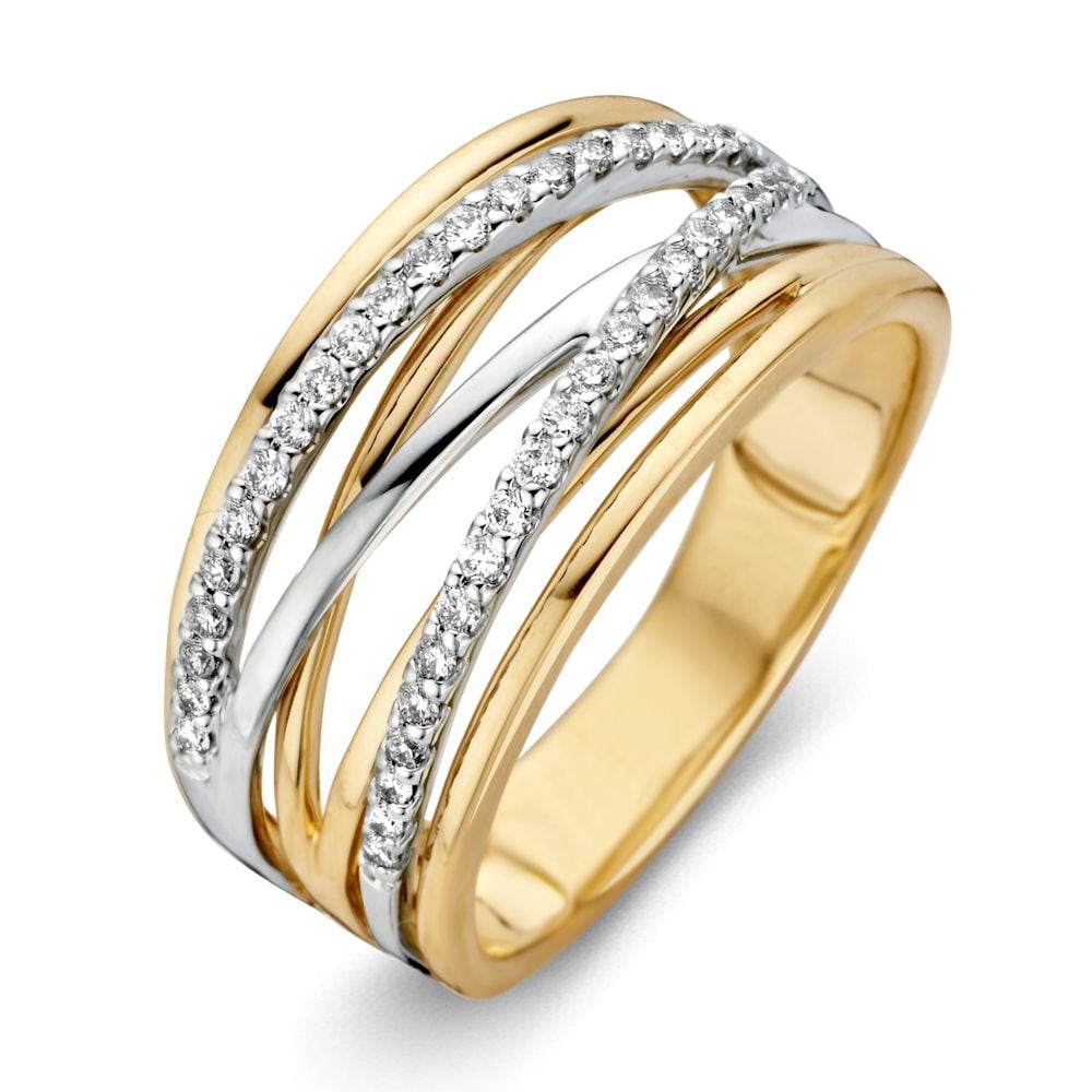 Bague bicolore en or avec diamant, composée de bandes dorées et argentées, ornée de zircons.