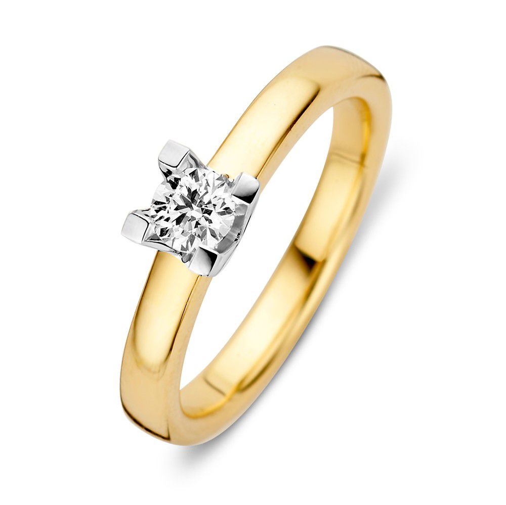 Bague en or jaune et blanc avec un diamant brillant de 0,30 crt en sertissage à quatre griffes.