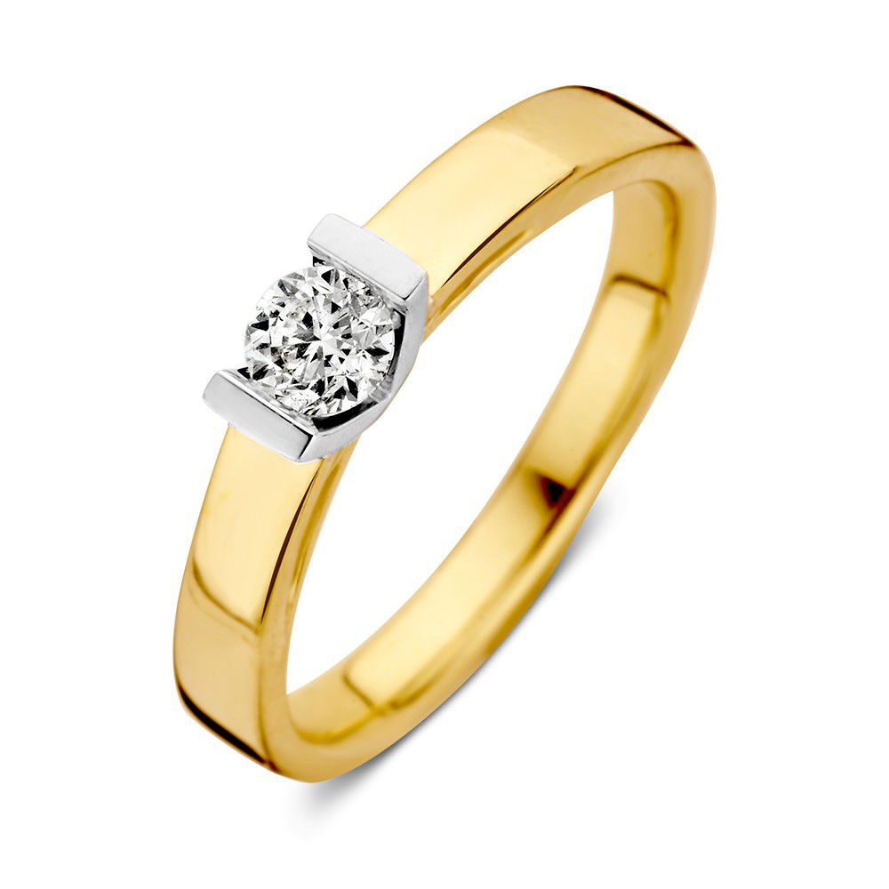 Bague en or jaune et blanc avec un diamant taillé en brillant de 0,30 crt.