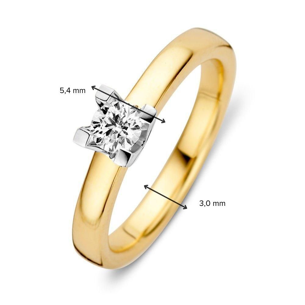 bague solitaire en or jaune et blanc avec diamant brillant de 0,30 ct et sertissage à quatre griffes 0,30 ct.