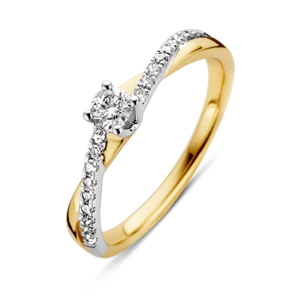 Bague bicolore en or jaune et blanc avec un diamant brillant de 0,32 ct.